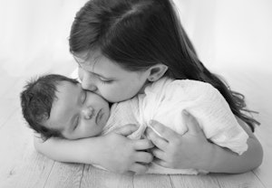 newborn girl with sister